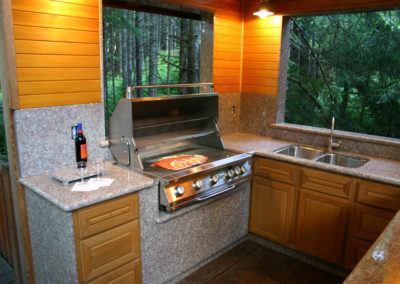Adventure Alaska Southeast, fish Alaska, relax in nature. BBQ situated in woods on a deck in Thorne Bay, Alaska