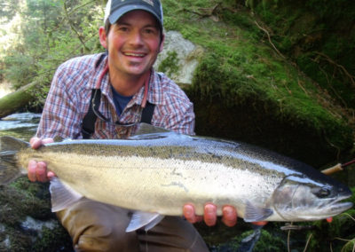 Fly-fishing on Prince of Wales Island Alaska. Man with steelhead.