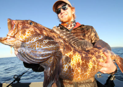 Alaska deep sea charter fishing with Adventure Alaska Southeast. Man with Ling cod.