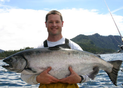 King Salmon fishing on Prince of Wales Island. Adventure Alaska Southeast fishing charters. Man holding giant King Salmon